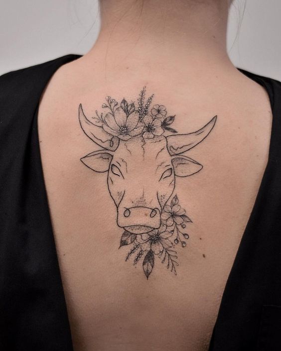 Taurus zodiac sign tattoo on the back for women