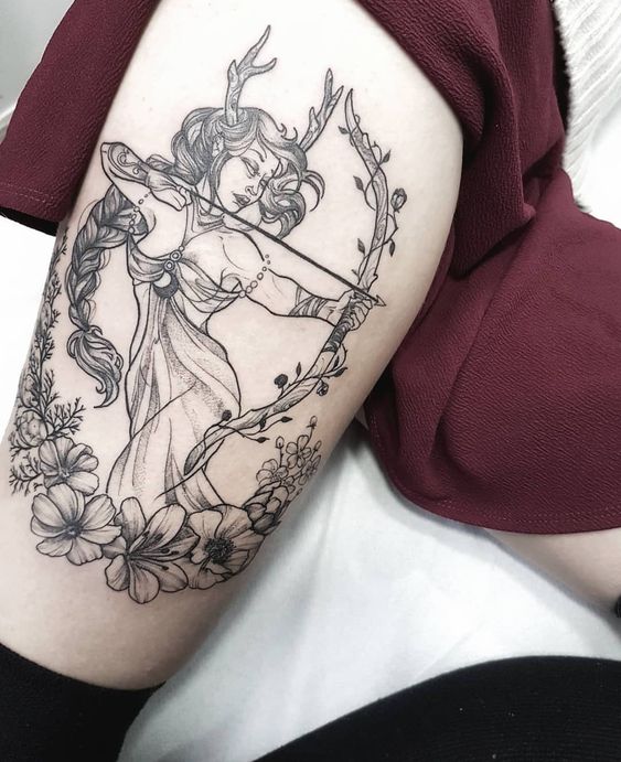 Tattoo of the zodiac sign Sagittarius on the leg for women