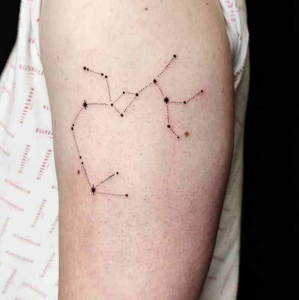 Tattoo the constellation sign of the zodiac Sagittarius on the shoulder for women