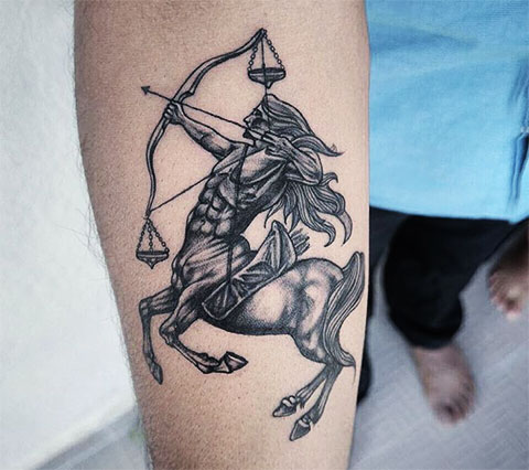 Tattoo of the zodiac sign Sagittarius on the forearm for men