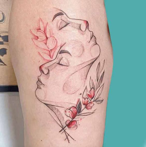 Tattoo of the zodiac sign Gemini on the leg for women