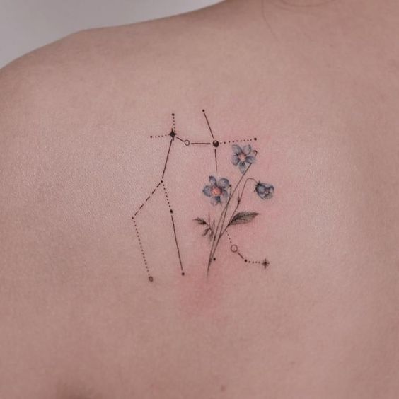 Tattoo the constellation sign of the zodiac Gemini on the shoulder blade for women