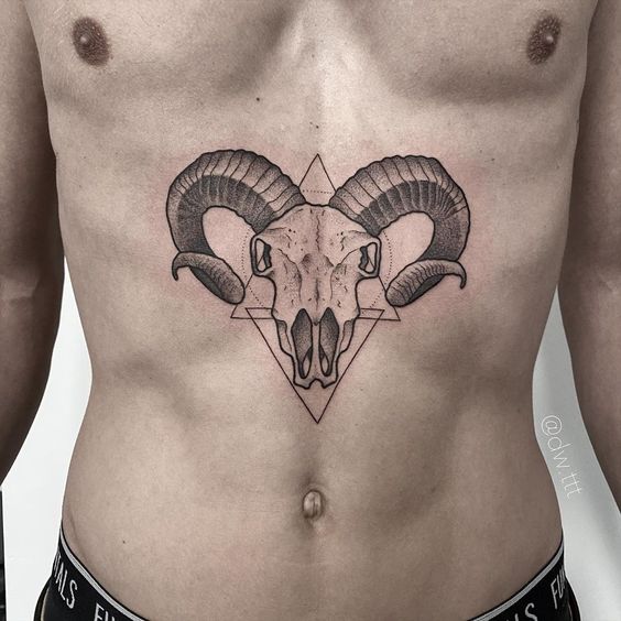 Tattoo of the zodiac sign of Aries on the stomach for men