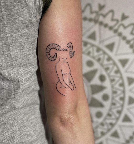 Tattoo of the zodiac sign of Aries on the shoulder for women