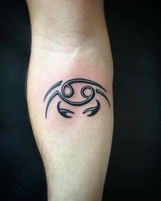 Tattoo of the zodiac sign Cancer on the forearm for men