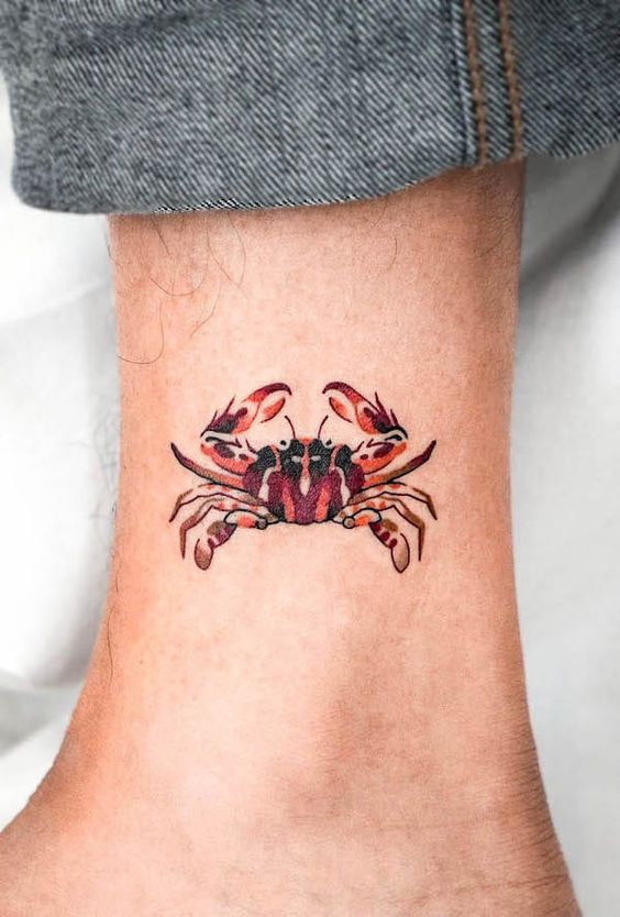 Tattoo of the zodiac sign of Cancer on the ankle for men