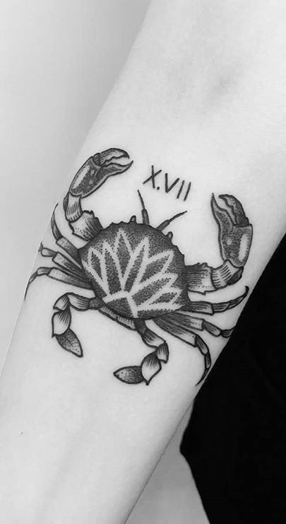 Zodiac sign cancer tattoo on forearm