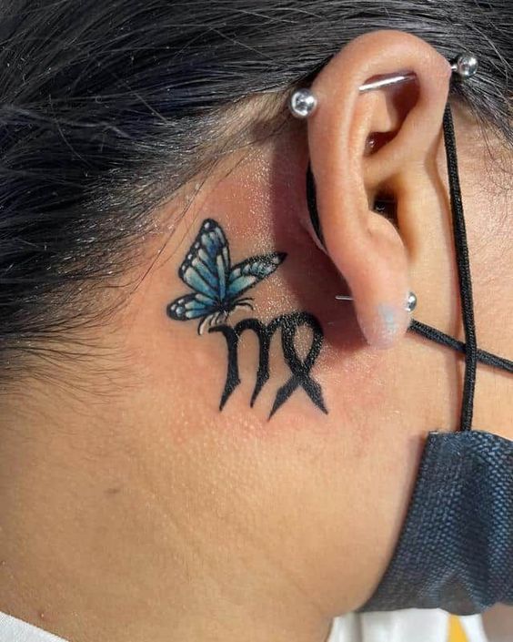 Tattoo symbol of the zodiac sign Virgo on the neck for women