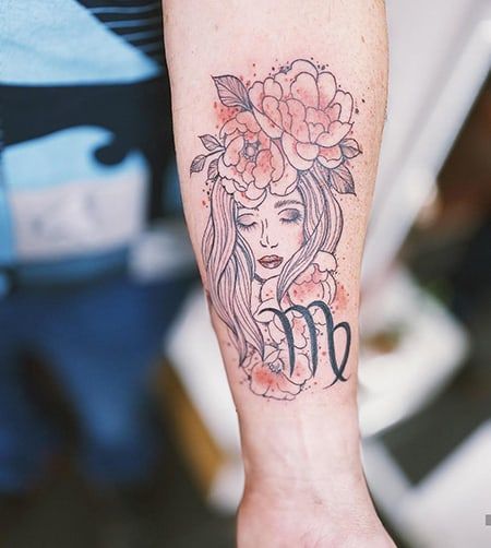 Tattoo of the zodiac sign Virgo on the forearm for women