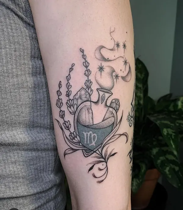 Tattoo of the zodiac sign Virgo on the shoulder for women