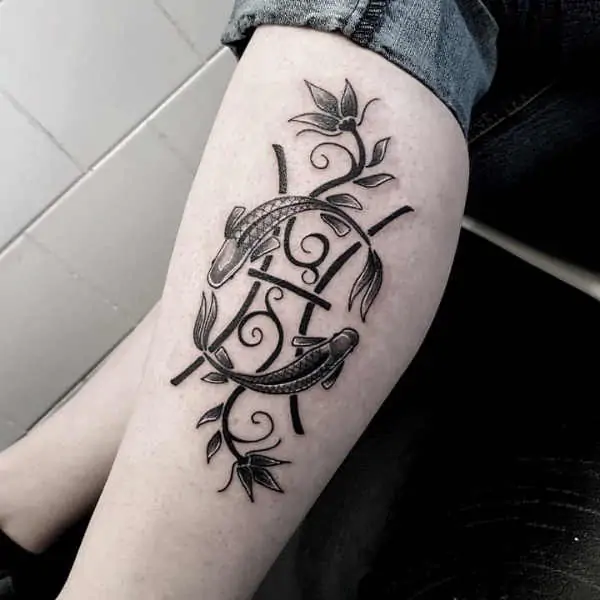 Tattoo symbol of the zodiac sign fish on the shin for men