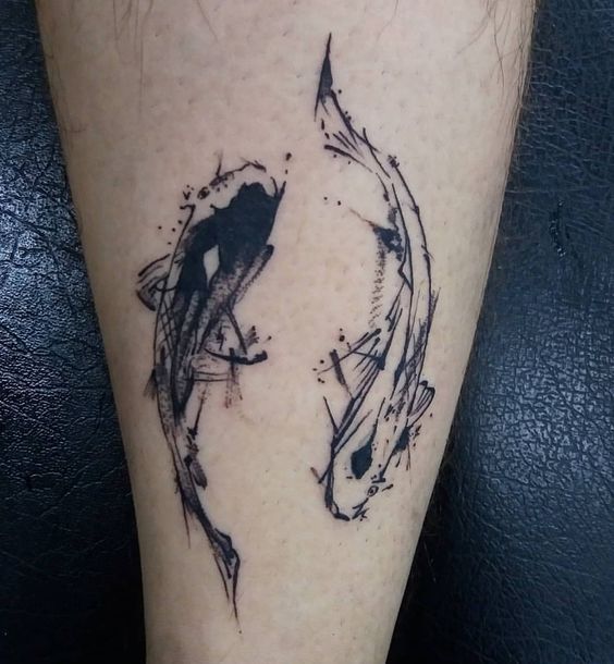 Tattoo of the zodiac sign of a fish on the shin for men