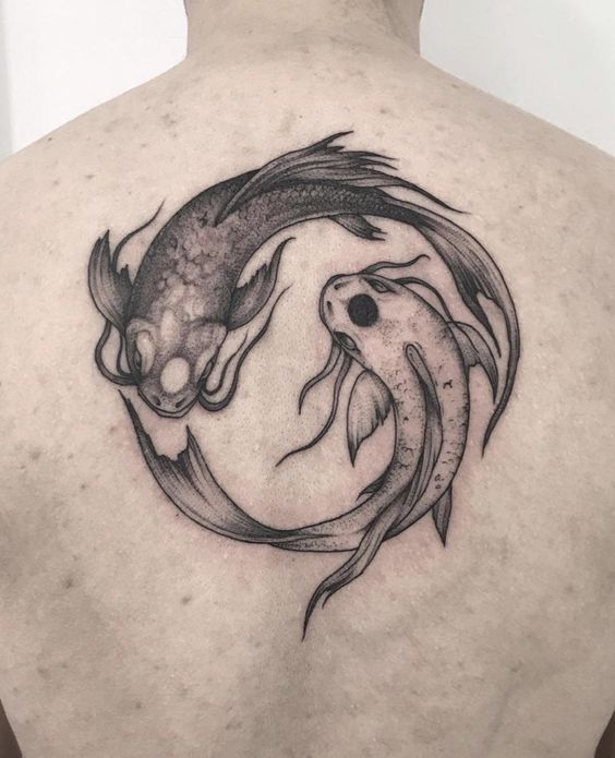 Tattoo of the zodiac sign fish on the back for men