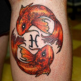 Tattoo symbol of the zodiac sign fish on the caviar for men