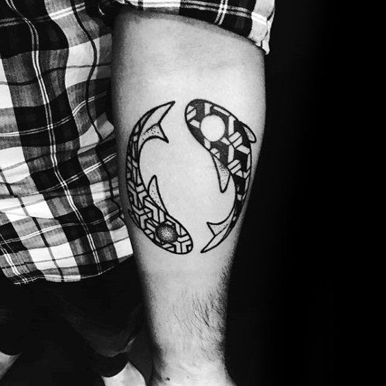 Tattoo of the zodiac sign of a fish on the forearm for men