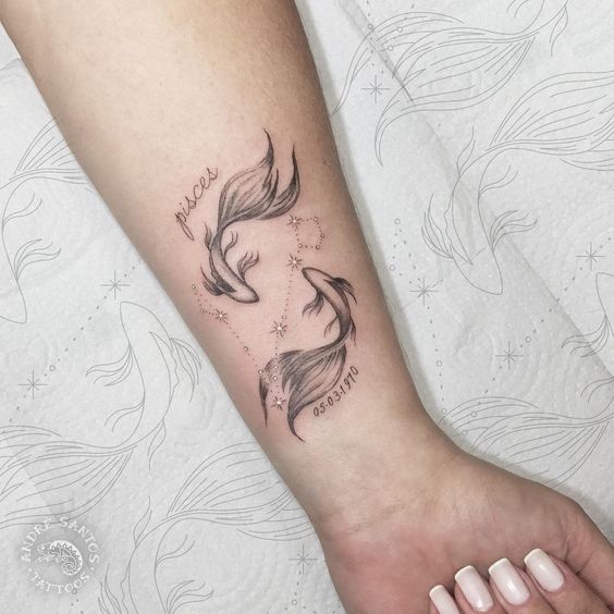 fish zodiac sign tattoo on forearm for women