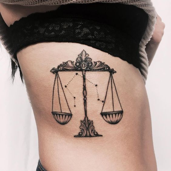 Tattoo the constellation sign of the zodiac Libra on the side for women