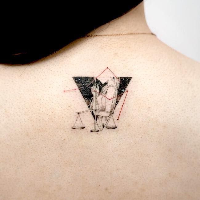 Tattoo the constellation sign of the zodiac Libra on the back for women