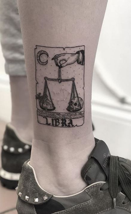 Tattoo of the zodiac sign Libra on the shin for men