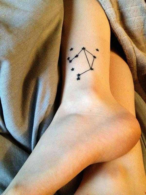 Tattoo the constellation sign of the zodiac Libra on the shin for women