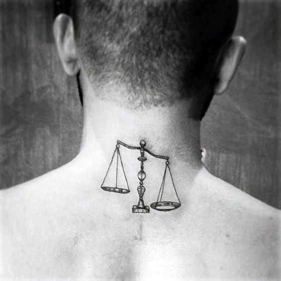 Tattoo of the zodiac sign Libra on the back of the head for men