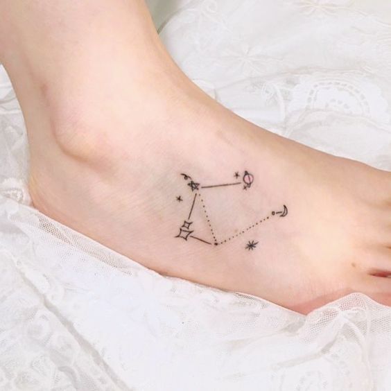 Tattoo the constellation sign of the zodiac Libra on the foot for women