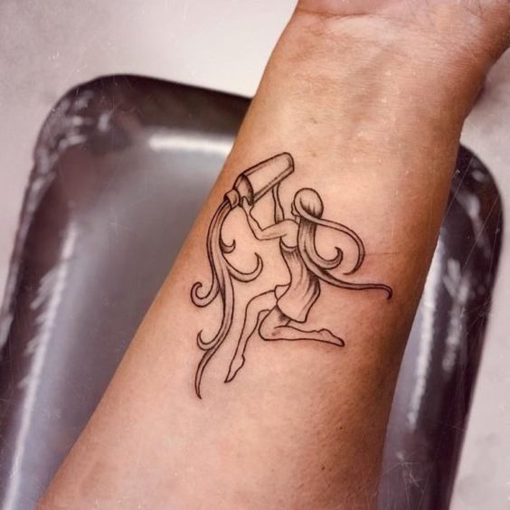 Aquarius zodiac sign tattoo on forearm