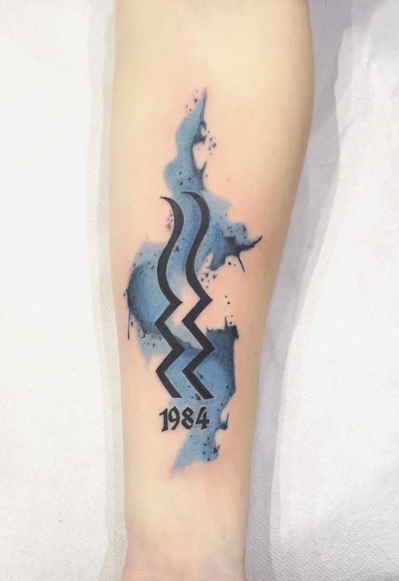 Tattoo of the zodiac sign Aquarius on the forearm