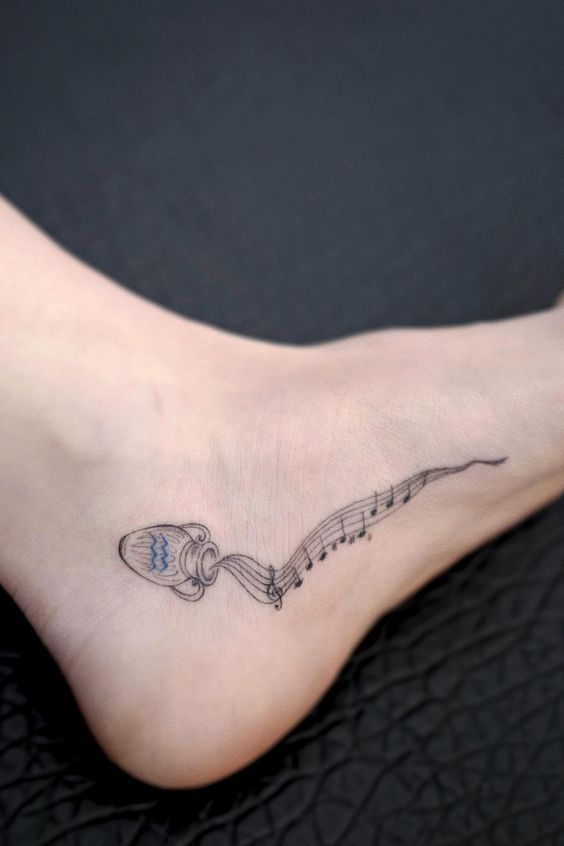 Aquarius zodiac sign tattoo on the foot for women