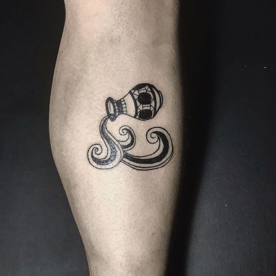 Aquarius zodiac sign tattoo on the shin for men