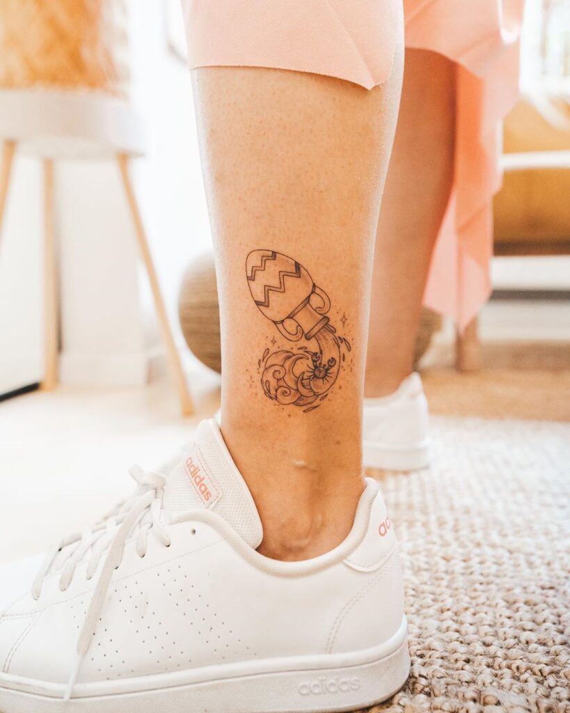 Aquarius zodiac sign tattoo on the shin for women