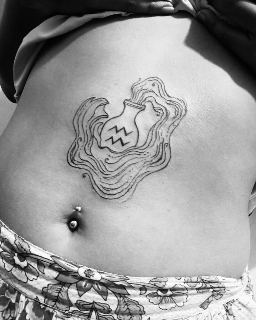 Aquarius zodiac sign tattoo on the stomach for women