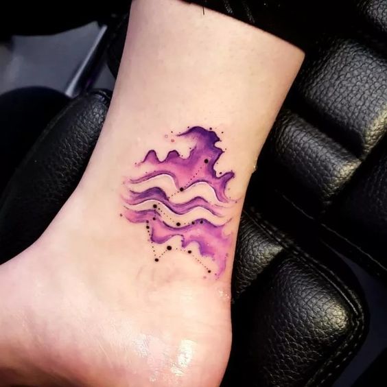 Tattoo of the zodiac sign Aquarius on the ankle for women