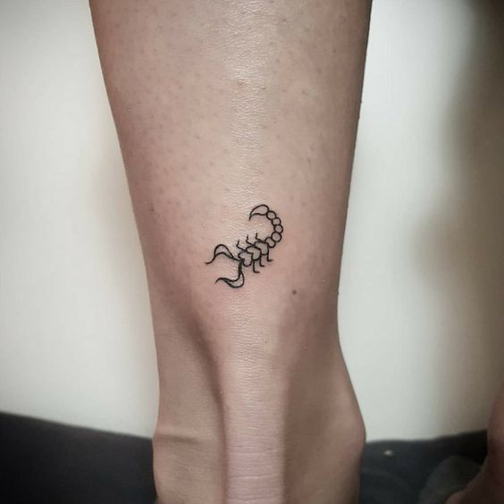 Tattoo of the zodiac sign of a scorpion on a calf