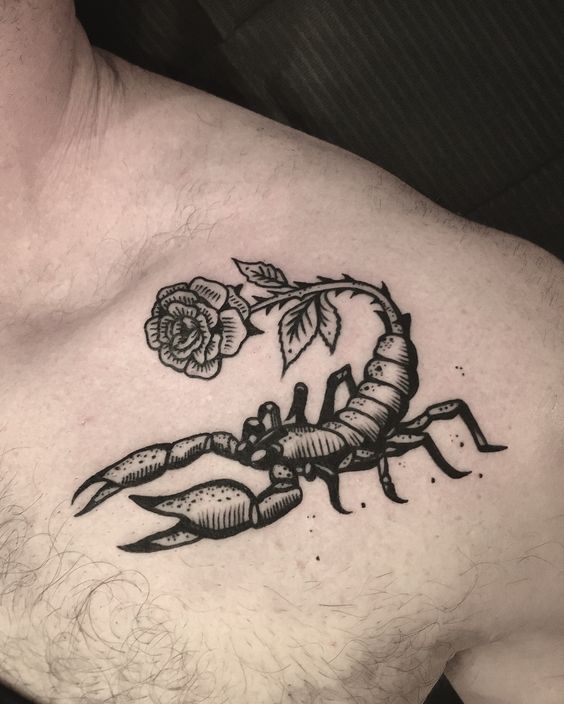 Tattoo of the zodiac sign of a scorpion on the shoulder for men