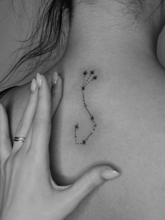 Tattoo the constellation sign of the zodiac scorpion on the back for women