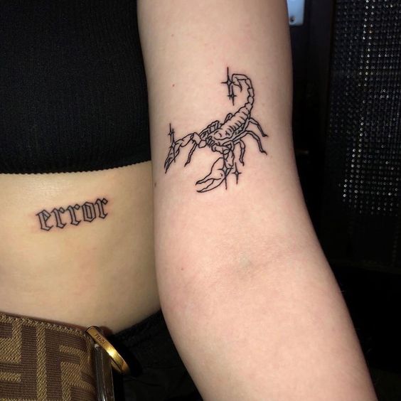 Tattoo of the zodiac sign of a scorpion on the shoulder for women