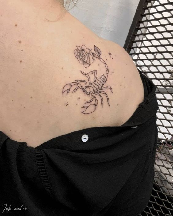 Tattoo of the zodiac sign of a scorpion on the shoulder blade for women