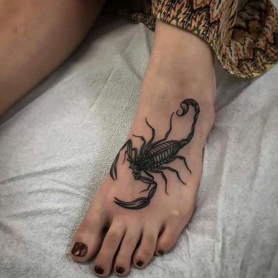 Tattoo of the zodiac sign of the scorpion on the ankle for women