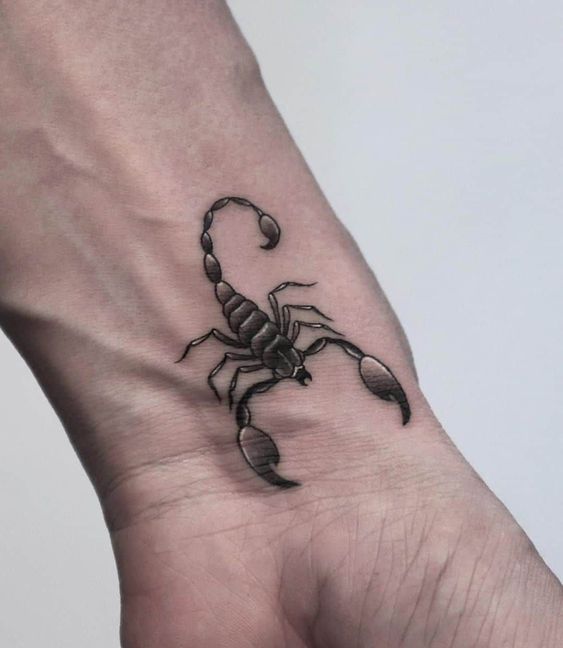 Tattoo of the zodiac sign of a scorpion on the wrist