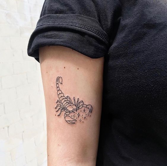 Tattoo of the zodiac sign of a scorpion on the shoulder for women