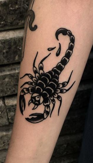 Tattoo of the zodiac sign of a scorpion on the forearm for men