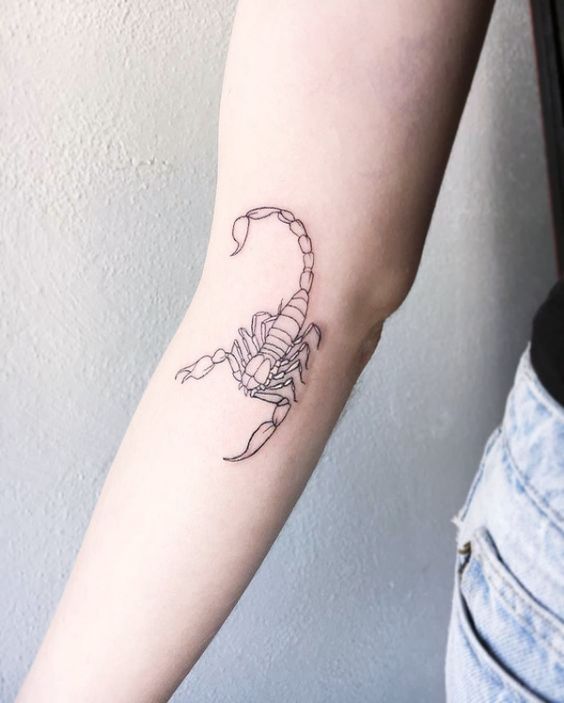 Tattoo of the zodiac sign of a scorpion on the forearm for women