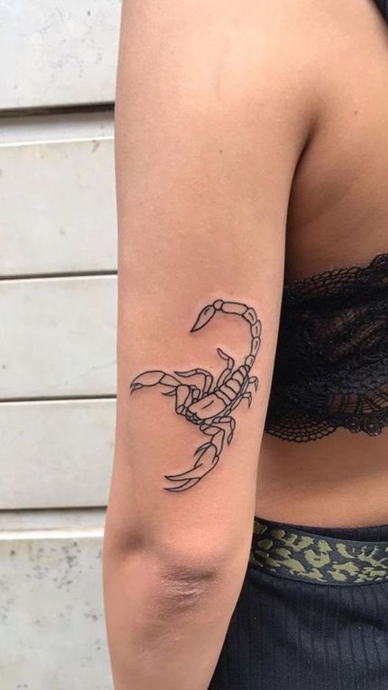 Tattoo of the zodiac sign of a scorpion on the shoulder for women