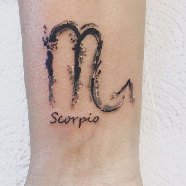 Tattoo of the zodiac sign scorpion on the wrist