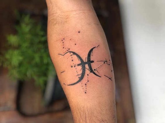 Tattoo symbol sign of the zodiac fisch on the forearm for men