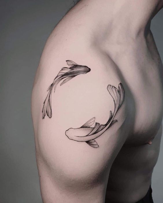 Tattoo of the zodiac sign of a fish on the shoulder for men