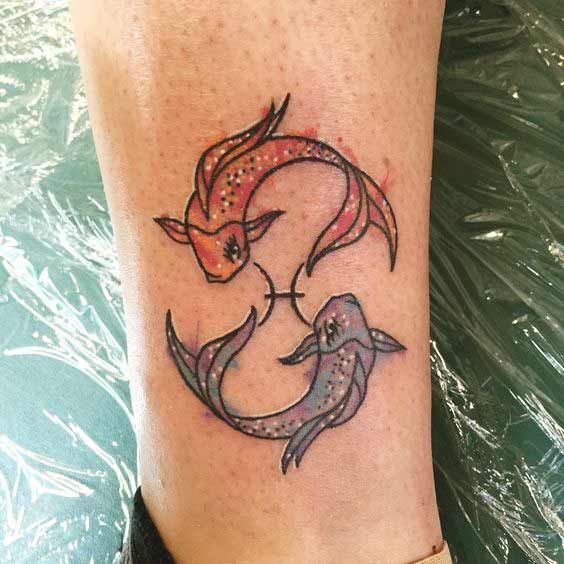 Tattoo of the zodiac sign fish on the shin for men