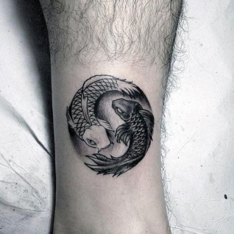 Tattoo of the zodiac sign of a fish on the shin for men