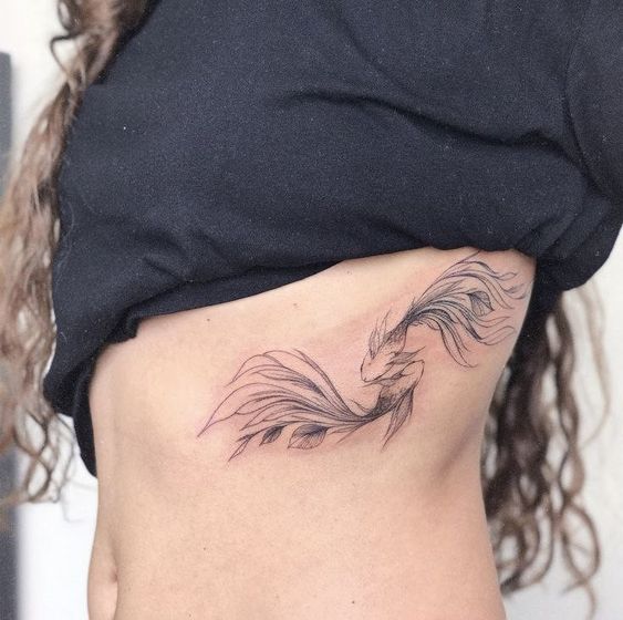 Fish zodiac sign tattoo on the side for women